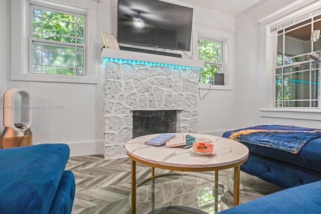 living room featuring parquet floors and plenty of natural light