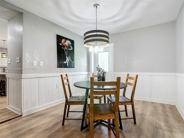 dining room featuring an inviting chandelier and hardwood / wood-style floors