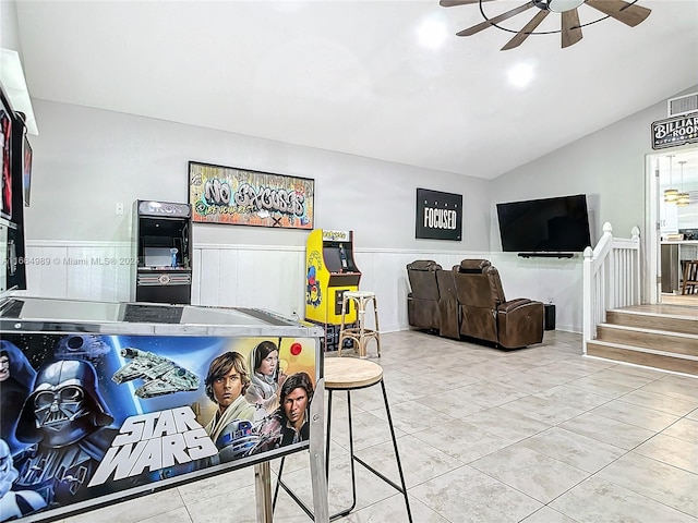 living room featuring lofted ceiling, ceiling fan, and tile patterned floors