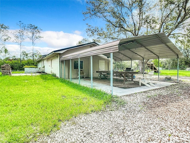 view of home's community featuring a patio area and a yard