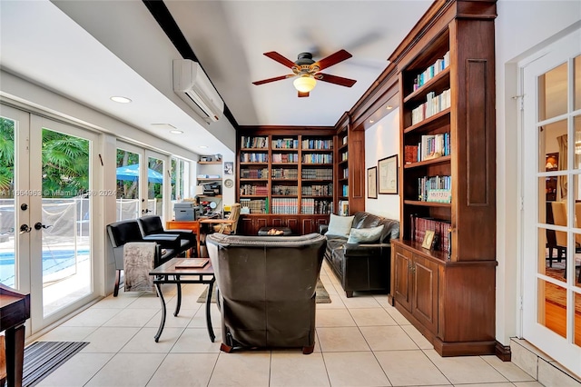 tiled office space with a wall mounted AC, ceiling fan, and french doors