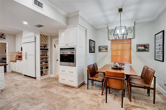 dining area featuring built in shelves, a chandelier, and ornamental molding