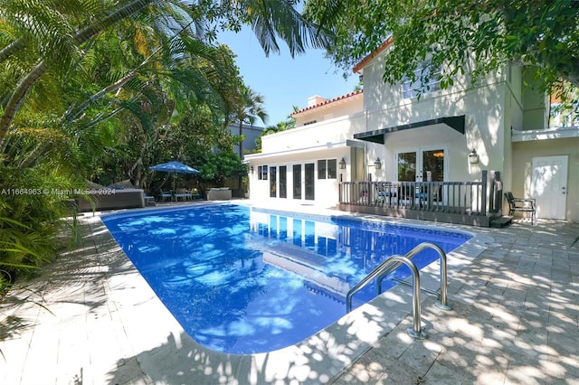 view of pool featuring a patio