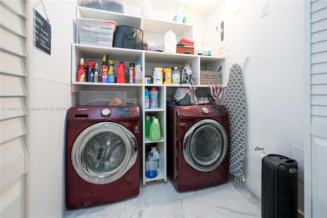 washroom with washing machine and dryer