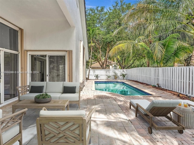 view of pool featuring an outdoor hangout area and a patio