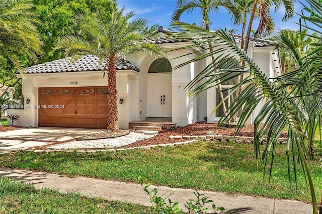 mediterranean / spanish-style home featuring a garage