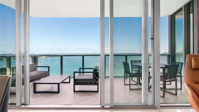 balcony featuring a water view