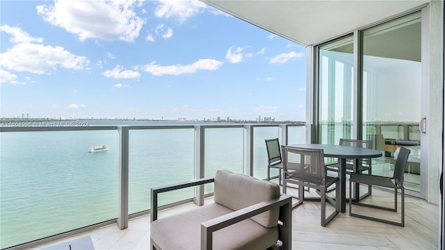 balcony featuring a water view