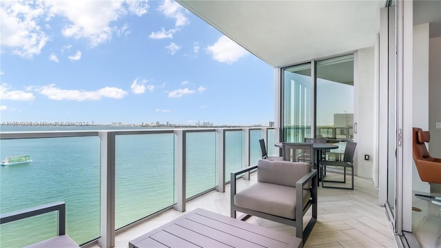 balcony featuring a water view