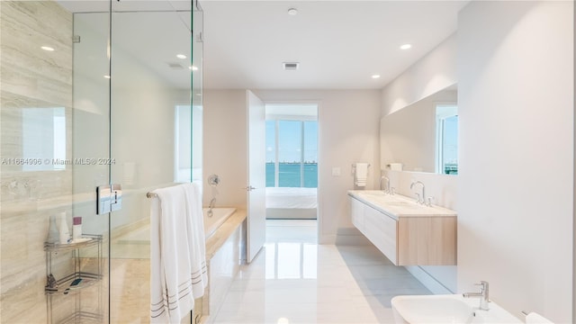 bathroom with plus walk in shower, a bidet, a water view, tile patterned floors, and vanity