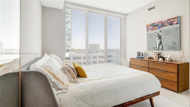 bedroom featuring light colored carpet