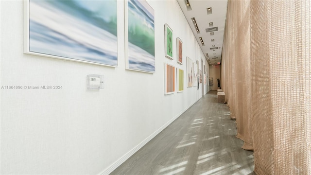 hallway featuring dark hardwood / wood-style flooring