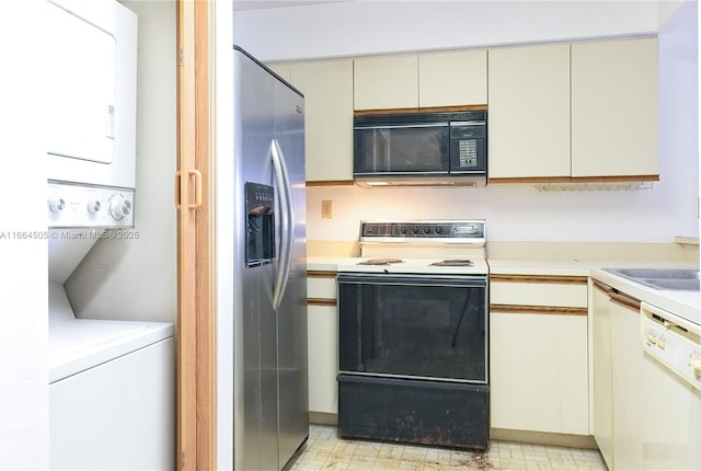 kitchen featuring stainless steel refrigerator with ice dispenser, electric range oven, white dishwasher, and cream cabinetry