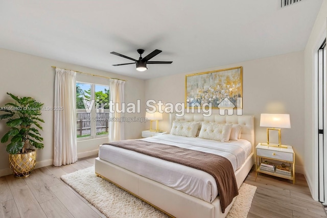 bedroom with ceiling fan and light hardwood / wood-style floors