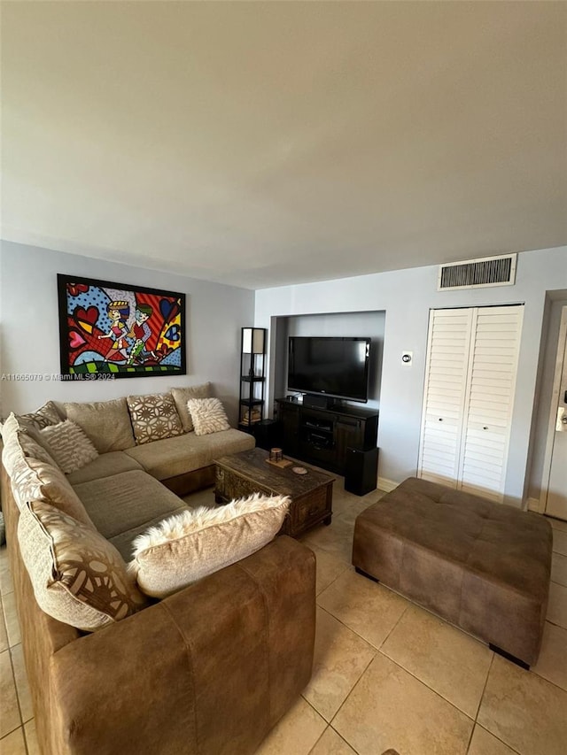 living room with light tile patterned floors