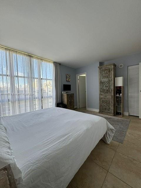 bedroom featuring light tile patterned floors