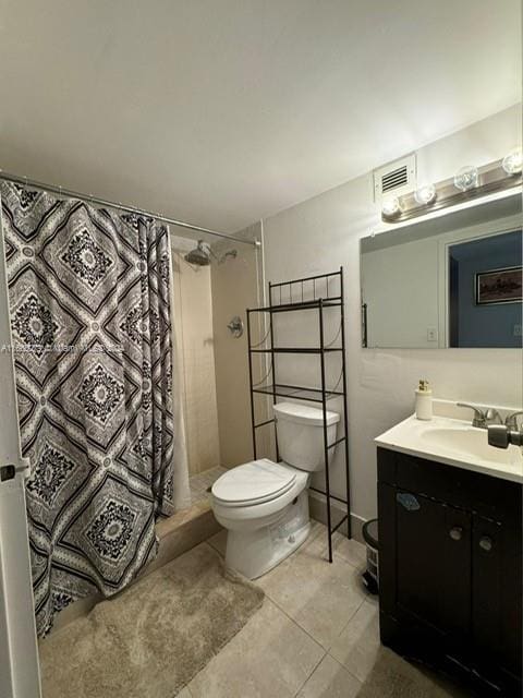 bathroom featuring vanity, tile patterned flooring, toilet, and a shower with shower curtain