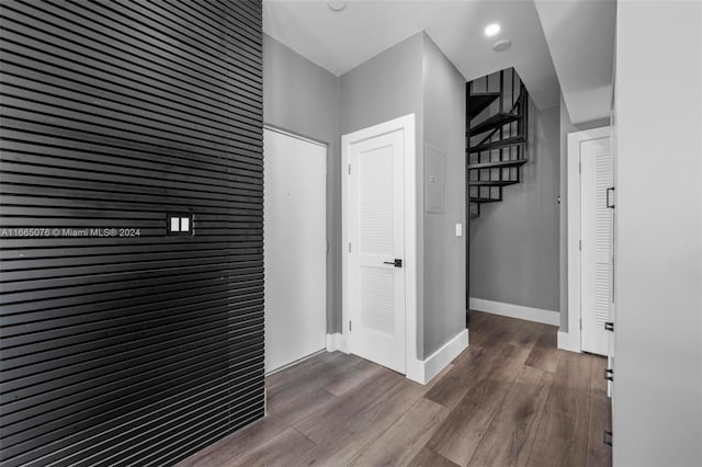 corridor with dark wood-type flooring