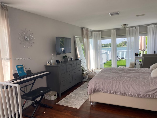 bedroom featuring dark wood-type flooring