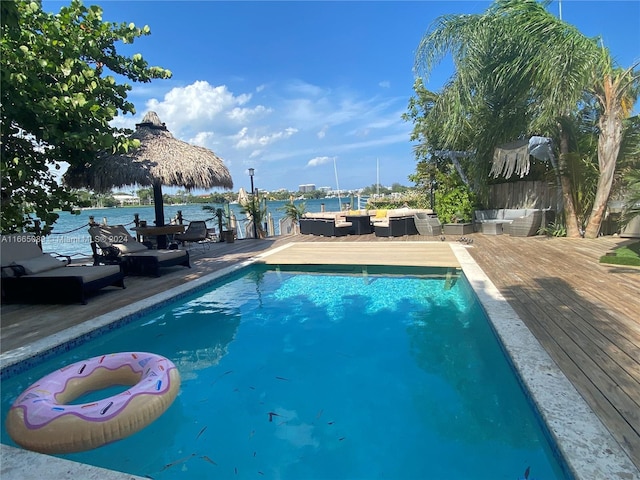 view of pool with a water view