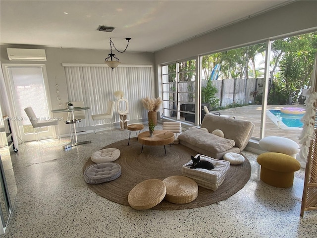 living room featuring a wall mounted air conditioner