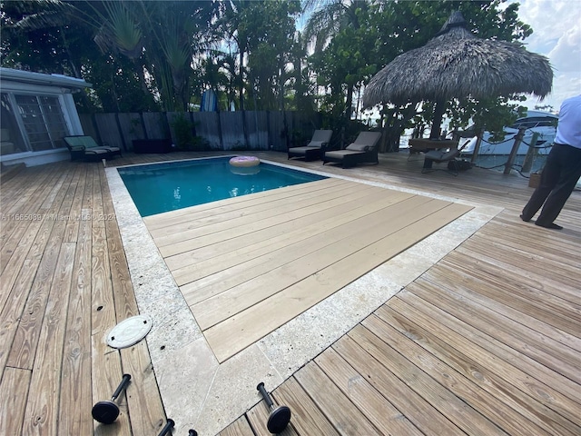 view of swimming pool with a deck