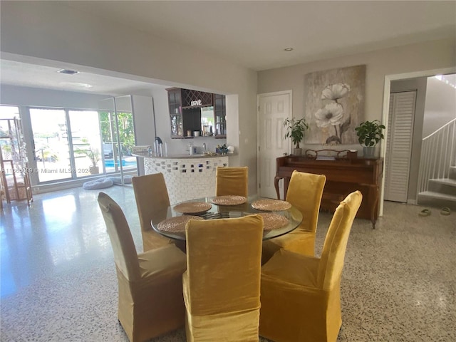 dining area featuring bar