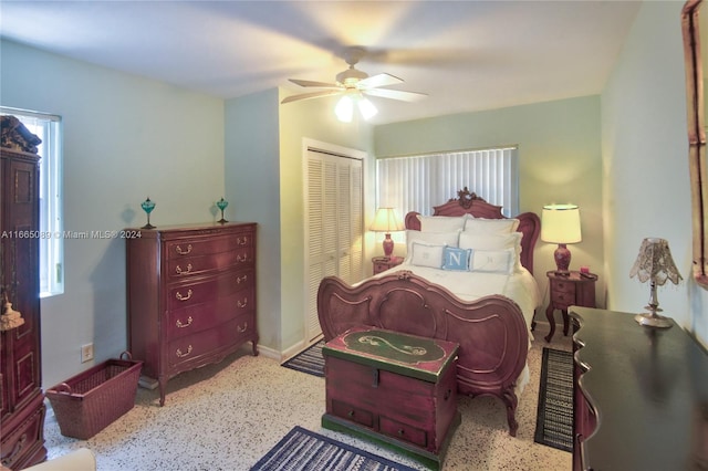 bedroom with ceiling fan and a closet