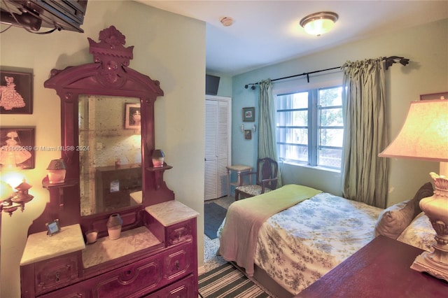 bedroom with a closet and carpet floors