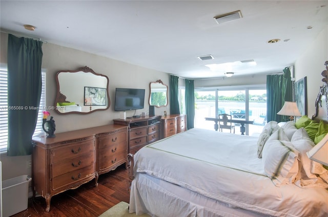 bedroom featuring dark hardwood / wood-style floors