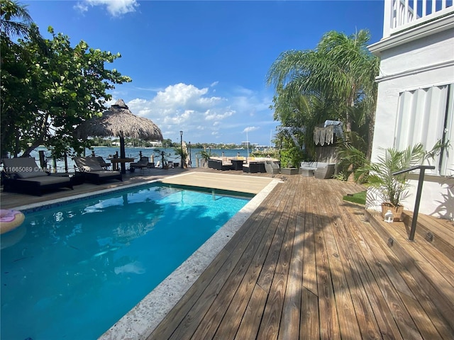 view of swimming pool with a water view