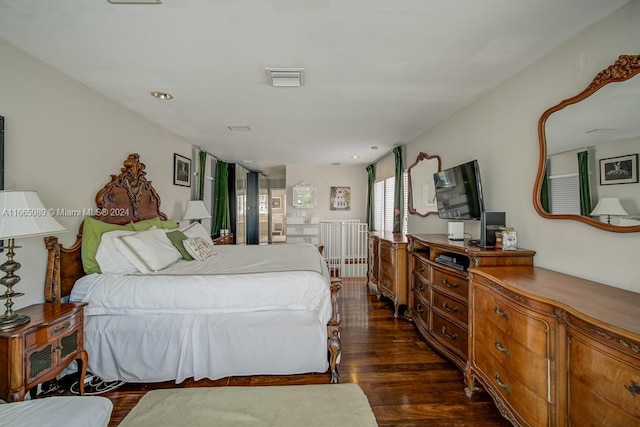 bedroom with dark wood-type flooring