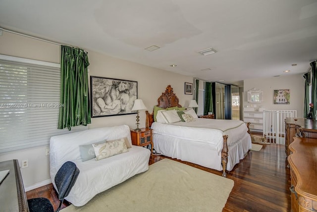 bedroom featuring dark hardwood / wood-style flooring