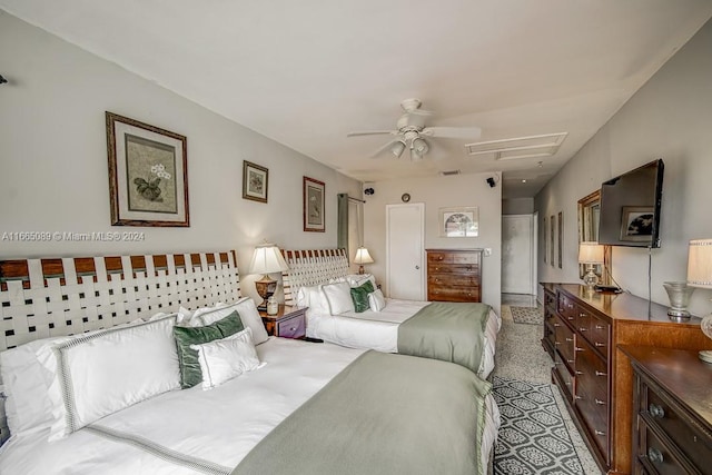 bedroom with ceiling fan and light carpet