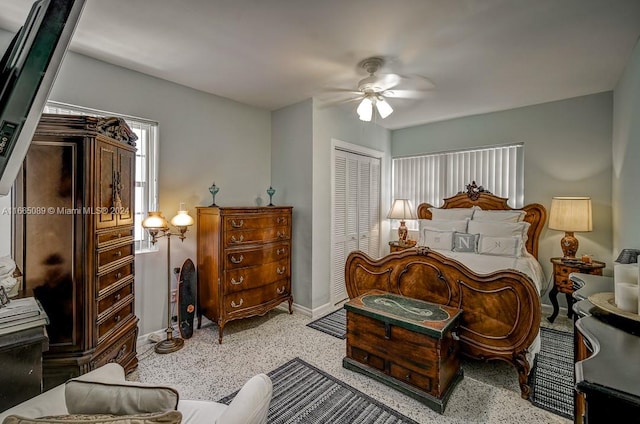 bedroom featuring ceiling fan and a closet