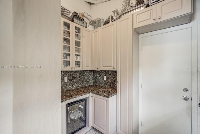 kitchen featuring dark stone countertops and decorative backsplash