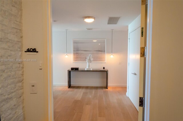 corridor featuring light hardwood / wood-style floors