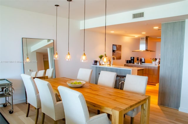 dining room with light hardwood / wood-style flooring