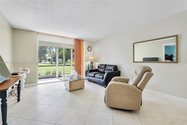 living room with a textured ceiling and light tile patterned floors