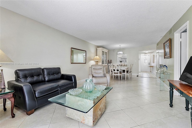 tiled living room with a textured ceiling