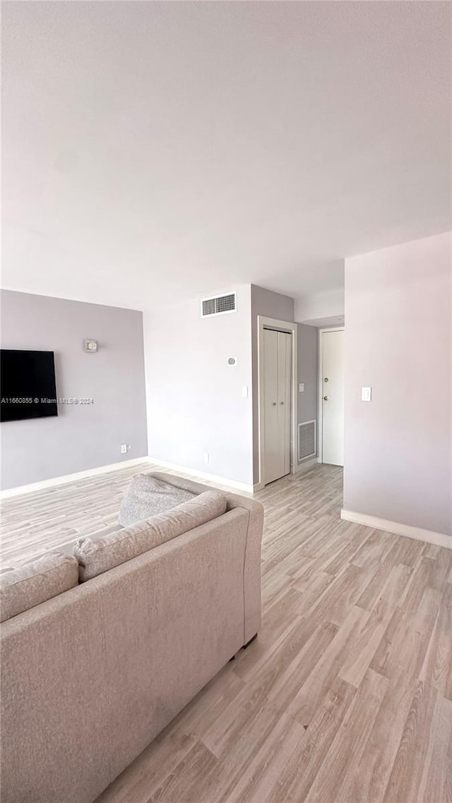 unfurnished living room featuring light hardwood / wood-style flooring