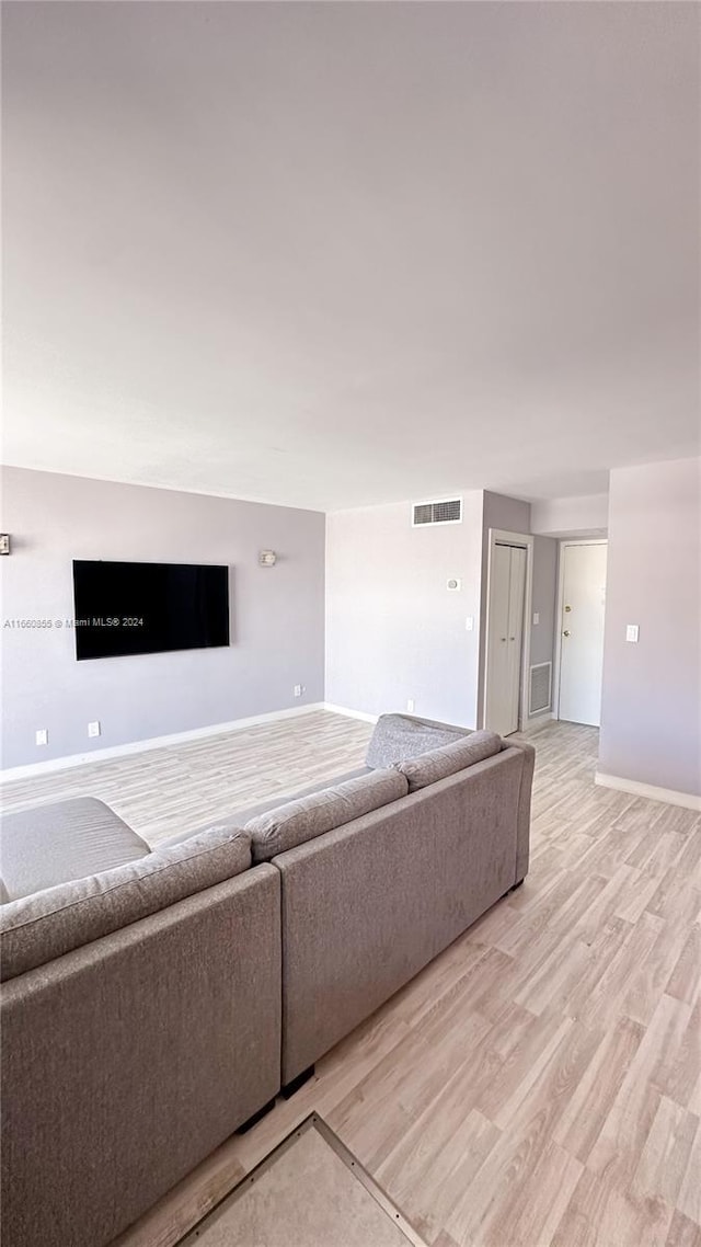 unfurnished living room with light wood-type flooring