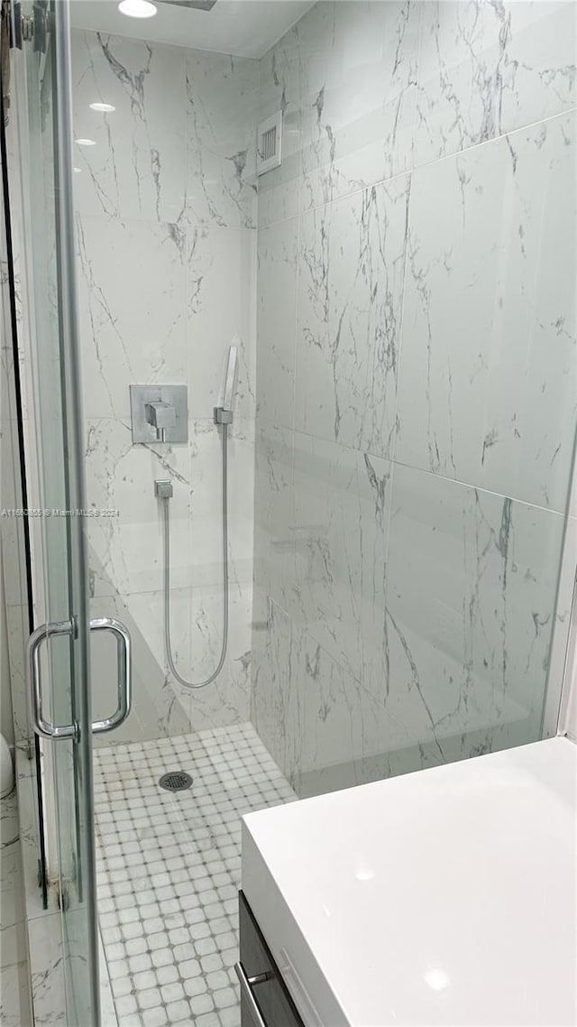 bathroom with vanity and an enclosed shower