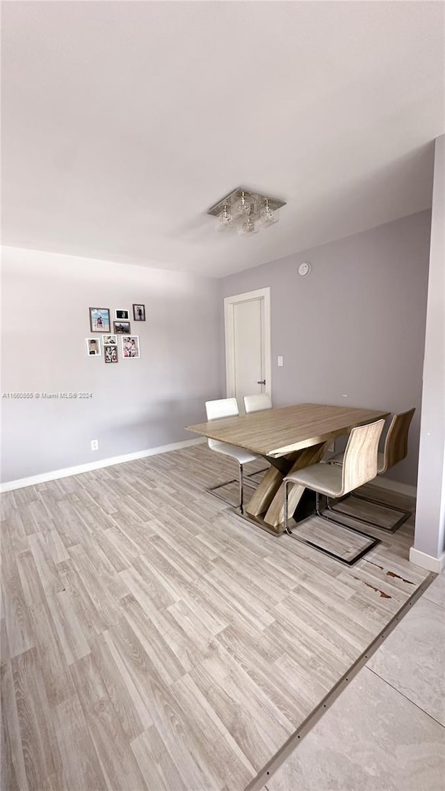 unfurnished room with light wood-type flooring