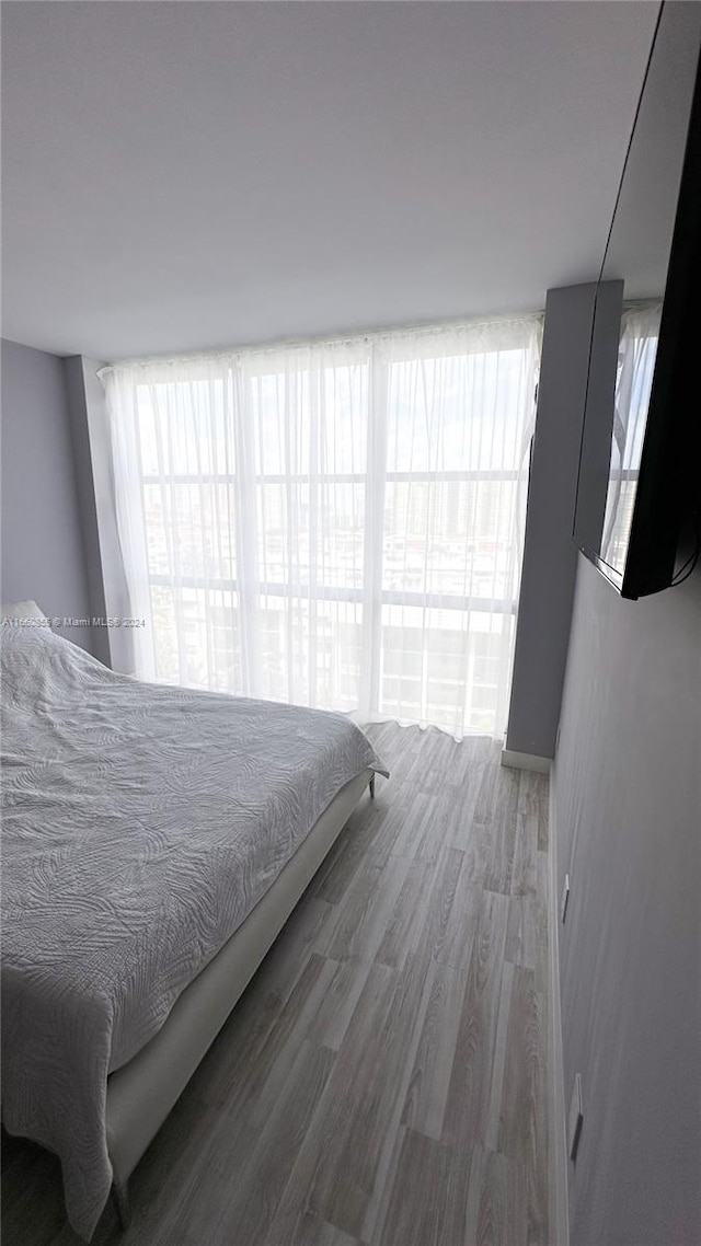 bedroom with hardwood / wood-style flooring