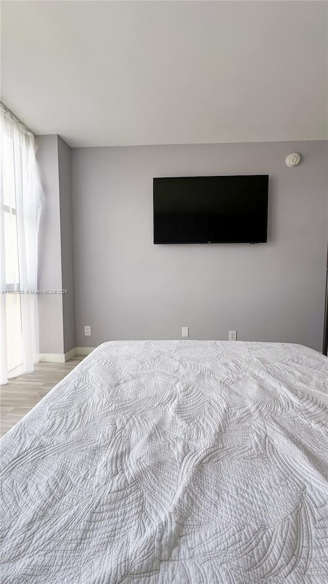 bedroom with light wood-type flooring