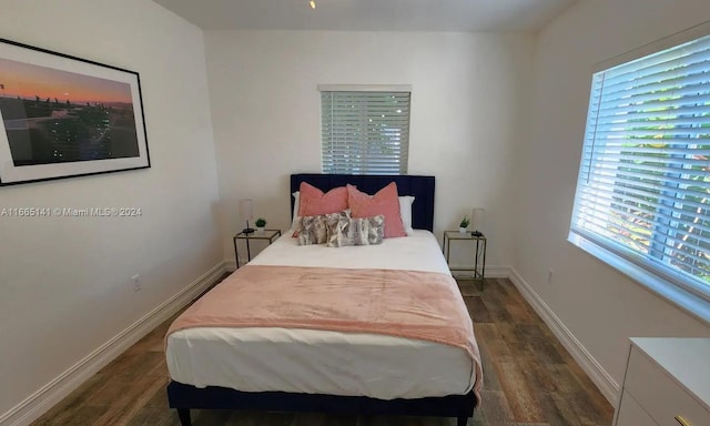 bedroom featuring dark wood-type flooring