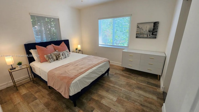 bedroom featuring dark hardwood / wood-style floors