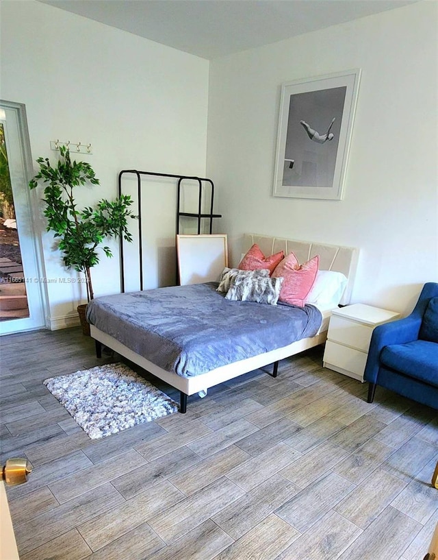 bedroom featuring wood-type flooring