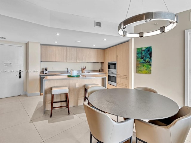 tiled dining room with sink